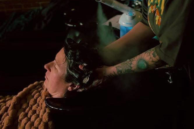 Woman getting a scalp massage.